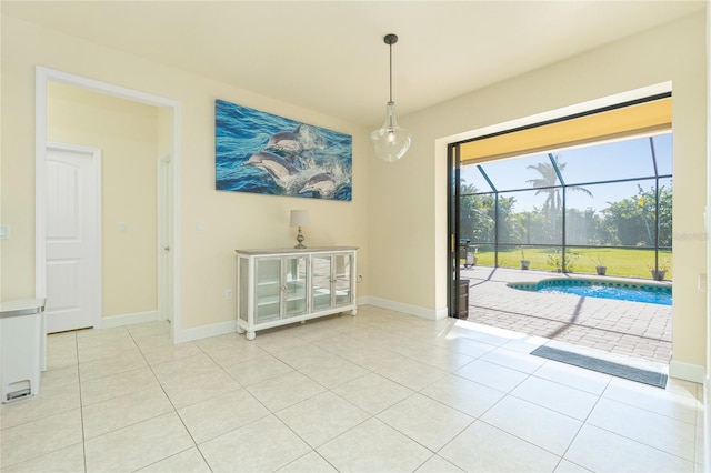 unfurnished dining area featuring light tile patterned flooring