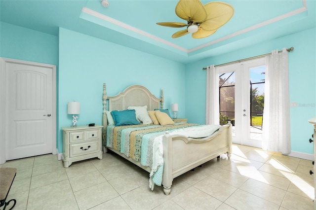 bedroom featuring french doors, access to outside, a raised ceiling, ceiling fan, and light tile patterned floors