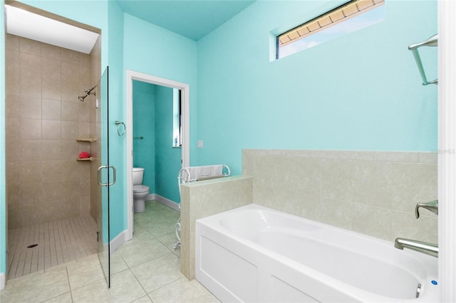 bathroom with tile patterned floors, toilet, and independent shower and bath