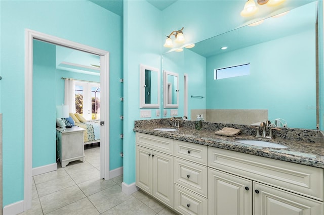 bathroom featuring tile patterned floors, vanity, and french doors