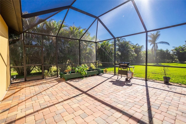 view of patio / terrace featuring a lanai