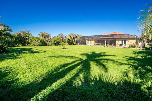 view of yard featuring a lanai