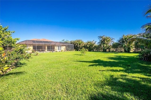 view of yard featuring a lanai