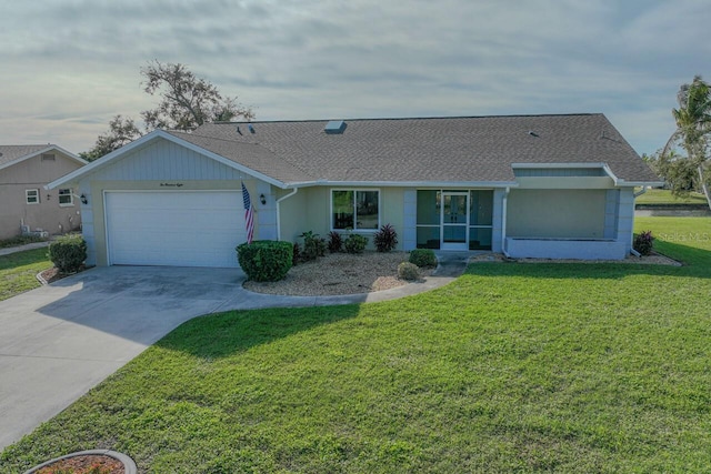 ranch-style home with a front yard and a garage