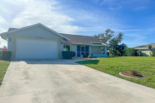 ranch-style house featuring a garage and a front lawn