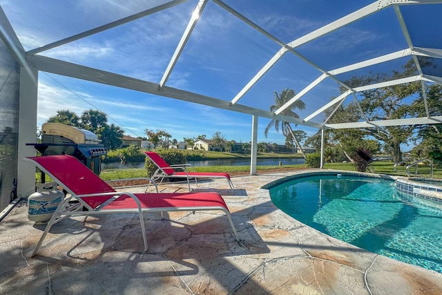 view of swimming pool with glass enclosure, a water view, and a patio