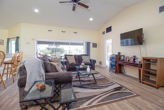 living room with light hardwood / wood-style flooring, ceiling fan, and lofted ceiling