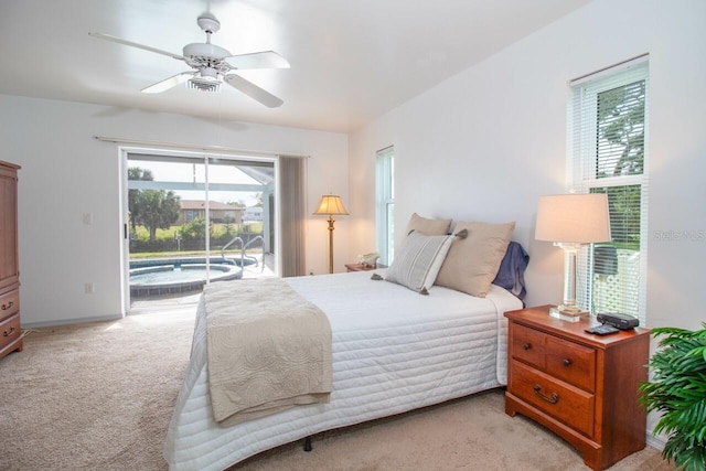 bedroom featuring access to outside, ceiling fan, and light colored carpet