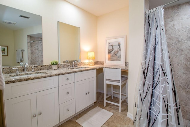 bathroom with vanity and curtained shower