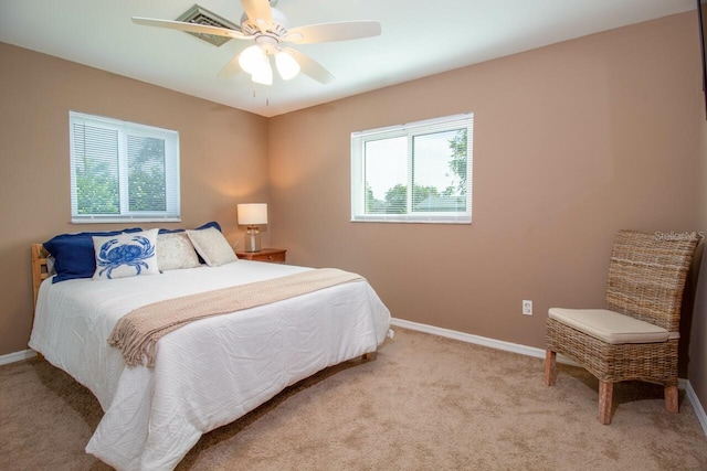 carpeted bedroom featuring ceiling fan