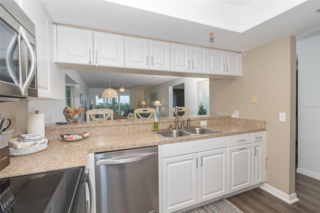 kitchen featuring white cabinets, dark hardwood / wood-style floors, sink, and stainless steel appliances