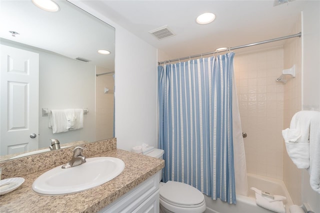 full bathroom with shower / bath combo, vanity, and toilet