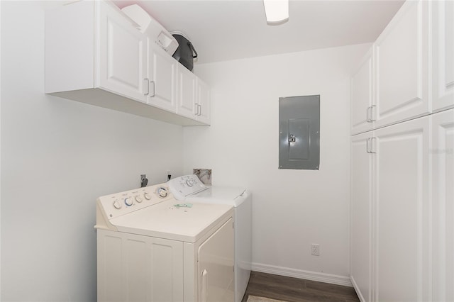 laundry area with electric panel, dark wood-type flooring, cabinets, and washing machine and dryer