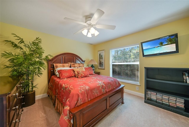 bedroom with light colored carpet and ceiling fan