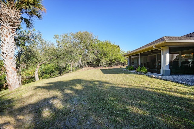 view of yard featuring a sunroom