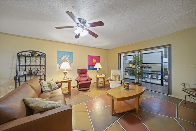 living room with tile patterned flooring, a textured ceiling, and ceiling fan