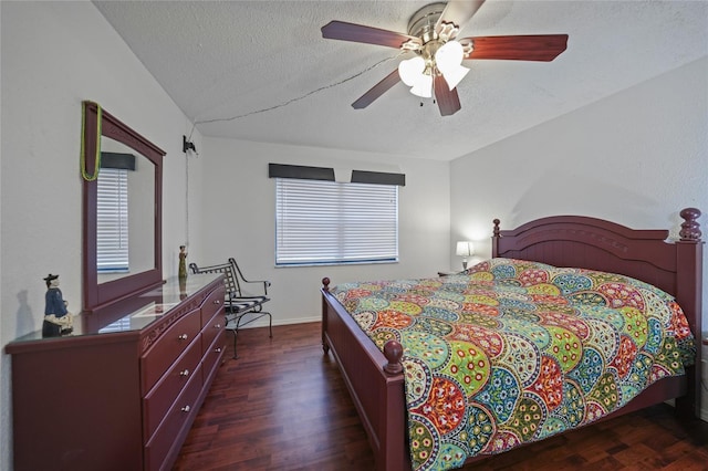 bedroom with a textured ceiling, dark hardwood / wood-style flooring, and ceiling fan