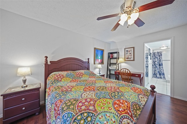 bedroom with a textured ceiling, dark hardwood / wood-style floors, ensuite bath, and ceiling fan