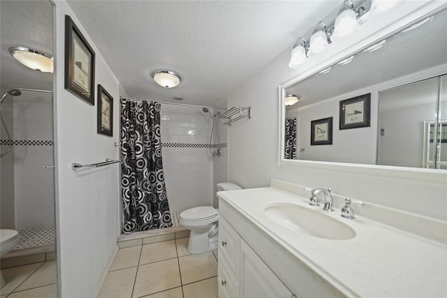 bathroom with tile patterned flooring, toilet, a textured ceiling, and walk in shower