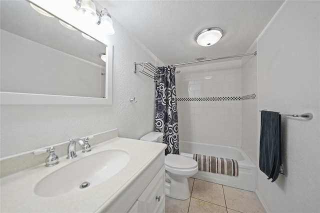 full bathroom with a textured ceiling, tile patterned flooring, vanity, and shower / tub combo