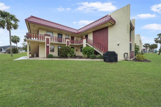 back of house with a yard