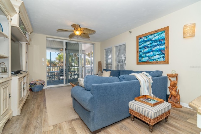 living room with ceiling fan and light hardwood / wood-style floors