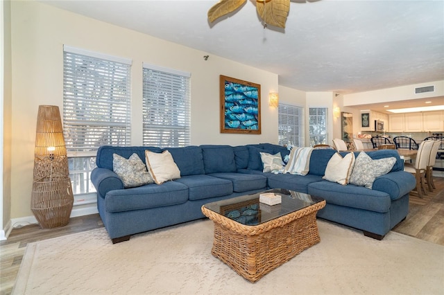 living room with light hardwood / wood-style flooring