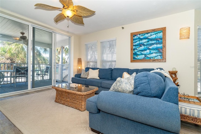 living room with hardwood / wood-style floors and ceiling fan