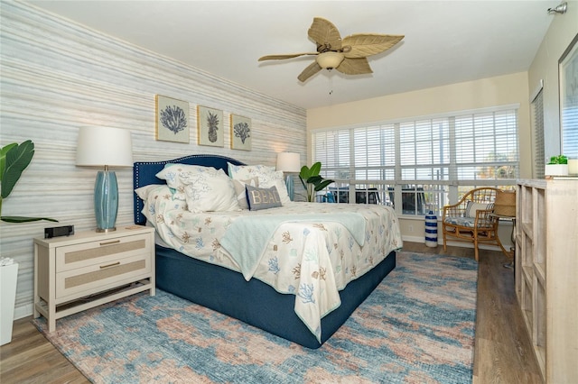 bedroom featuring dark hardwood / wood-style flooring and ceiling fan