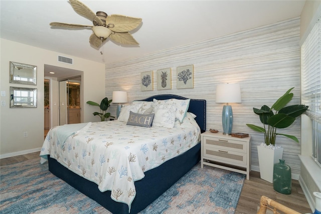 bedroom featuring hardwood / wood-style floors and ceiling fan