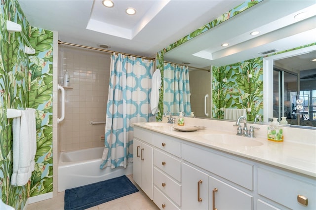 bathroom featuring tile patterned flooring, shower / bath combination with curtain, vanity, and a skylight