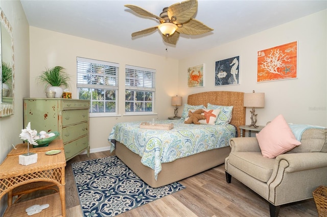 bedroom featuring ceiling fan and light hardwood / wood-style flooring