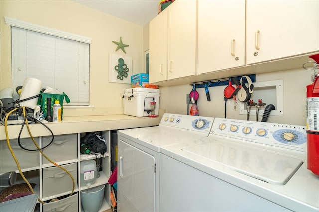 laundry room with cabinets and independent washer and dryer