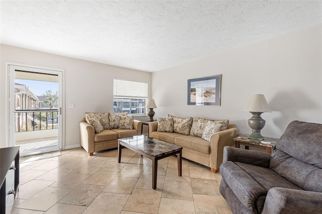 living room featuring a textured ceiling