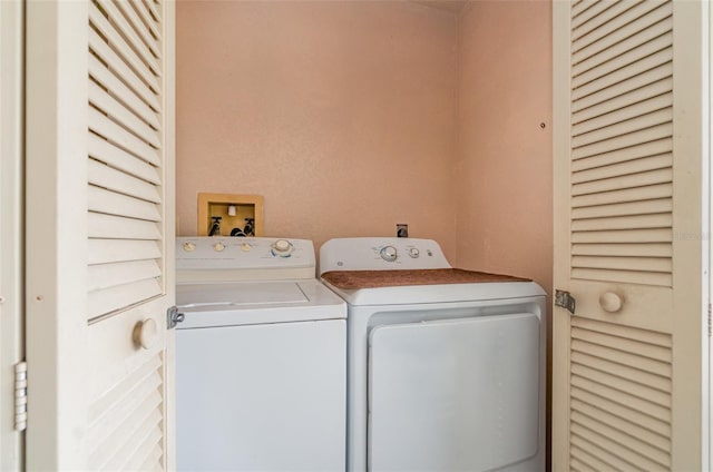 laundry room with separate washer and dryer