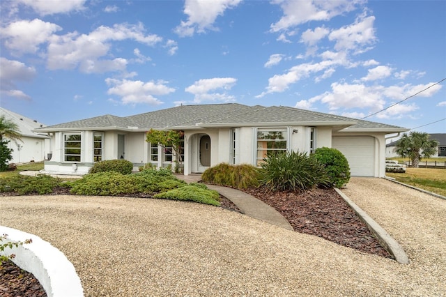 ranch-style house featuring a garage