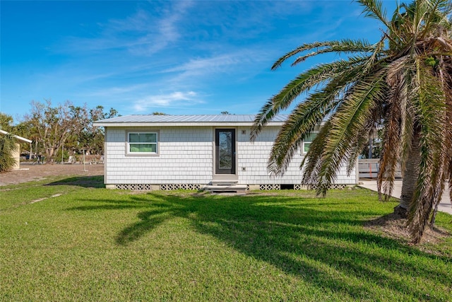 rear view of house with a lawn