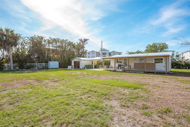 view of yard with covered porch and a shed