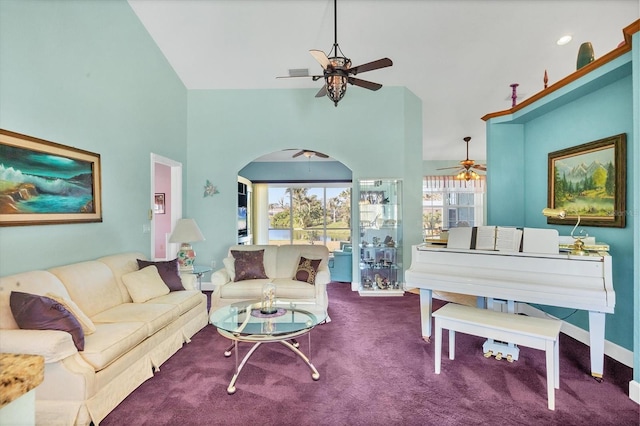 carpeted living room with a towering ceiling