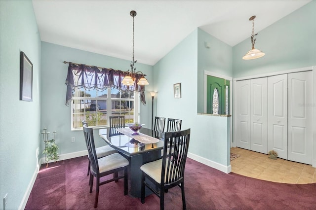 carpeted dining room with vaulted ceiling and a chandelier