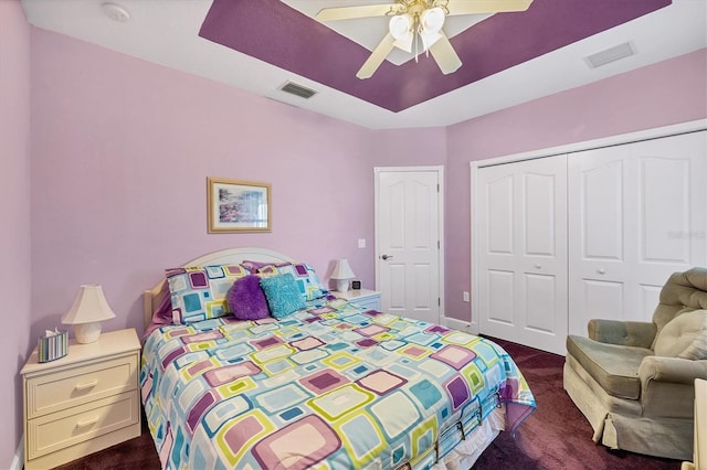 carpeted bedroom with a closet and ceiling fan