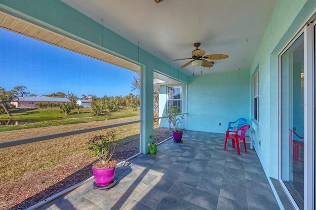 view of patio featuring ceiling fan