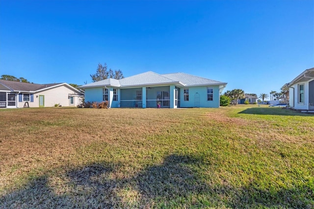 ranch-style home with a front lawn