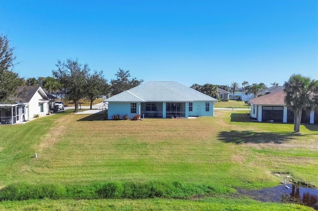 ranch-style home featuring a front yard