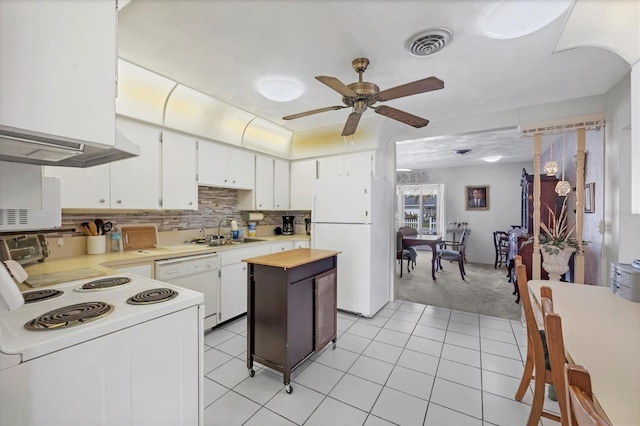 kitchen with sink, white cabinetry, a center island, ceiling fan, and white appliances