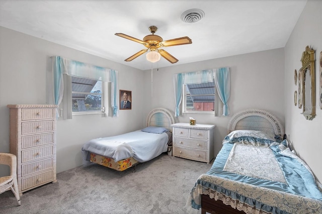 bedroom with light colored carpet and ceiling fan