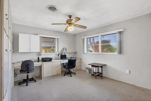 tiled home office with ceiling fan