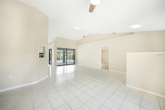 spare room featuring light tile patterned floors, ceiling fan, and lofted ceiling