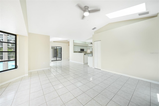 unfurnished living room featuring ceiling fan, light tile patterned floors, and lofted ceiling