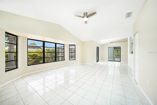 tiled empty room featuring ceiling fan and lofted ceiling